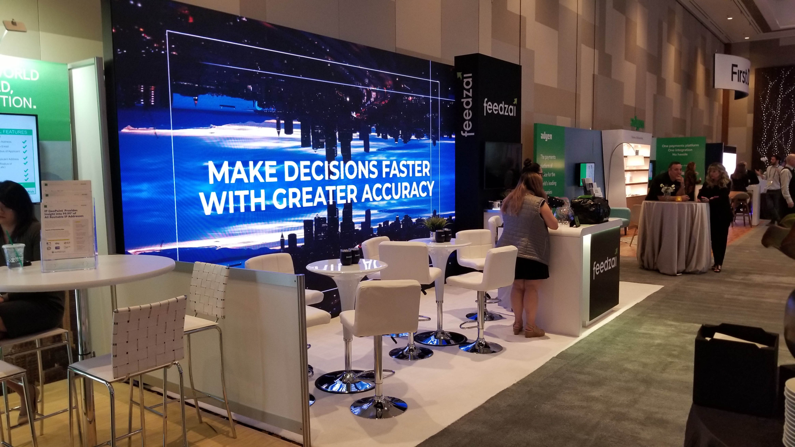 20x10 custom trade show booth with LED video wall, product demo area, branded counter and high-impact aisle visibility