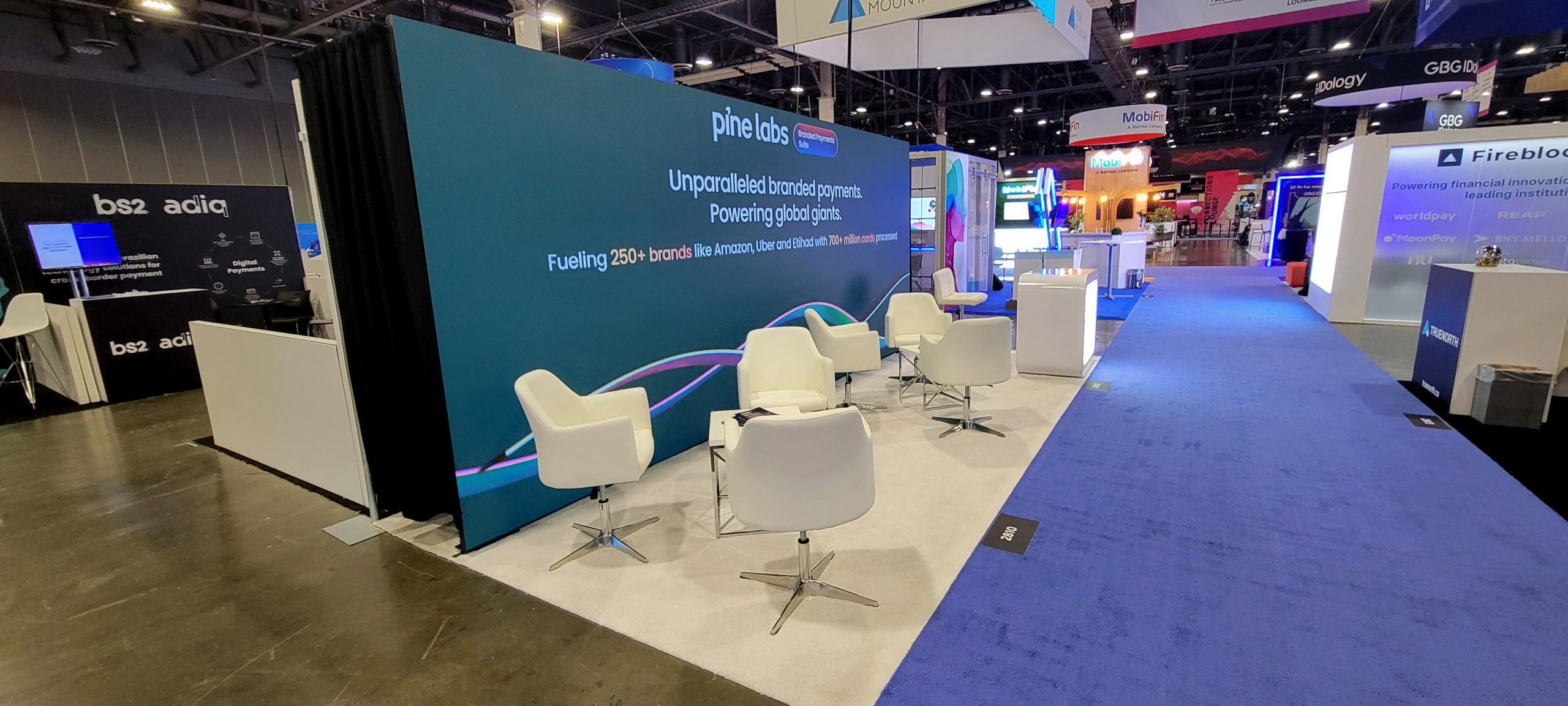 20x10 full-width LED backwall exhibit with branded counter, open visitor space and strong trade show aisle visibility