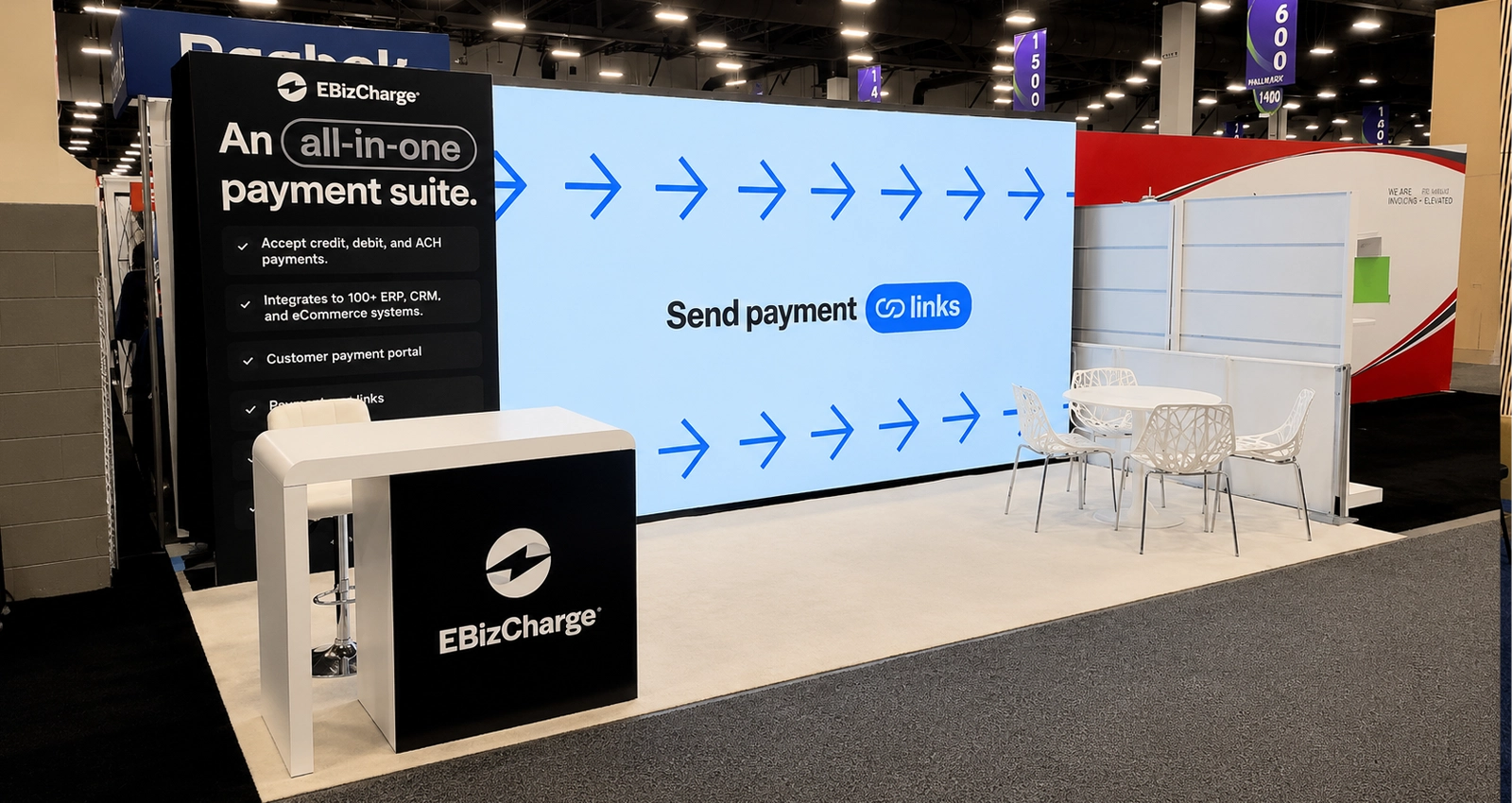20x10 exhibit designs with custom inline LED trade show booth, video wall, branded reception counter and open visitor space