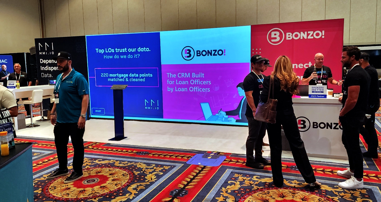 30x10 custom inline trade show exhibit with LED video wall and branded booth structure