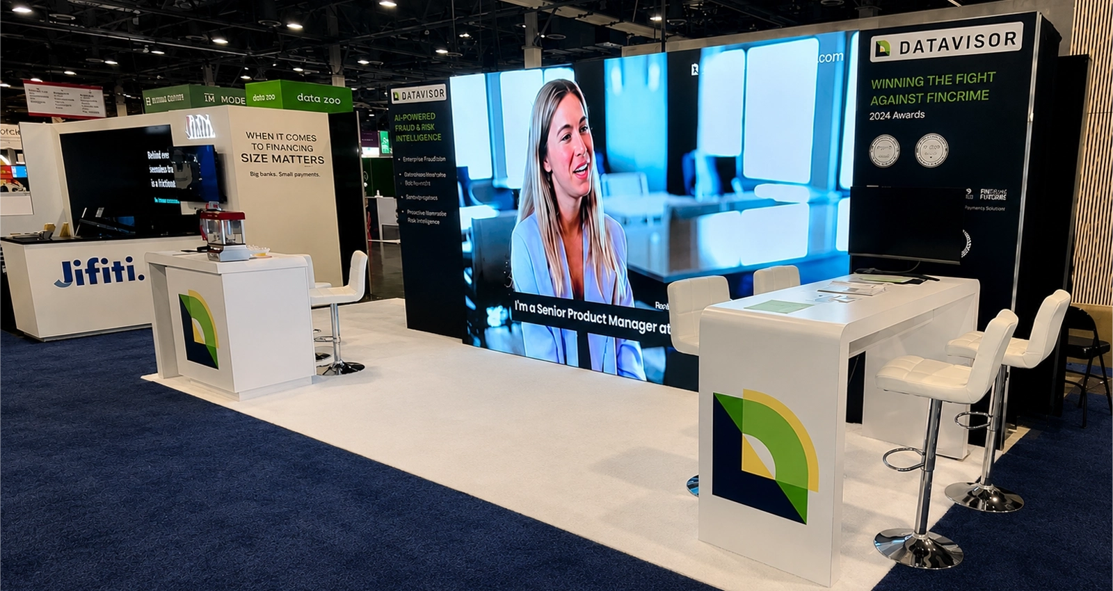 Las Vegas trade show exhibit with LED video wall, counters, seating, and show-floor booth layout
